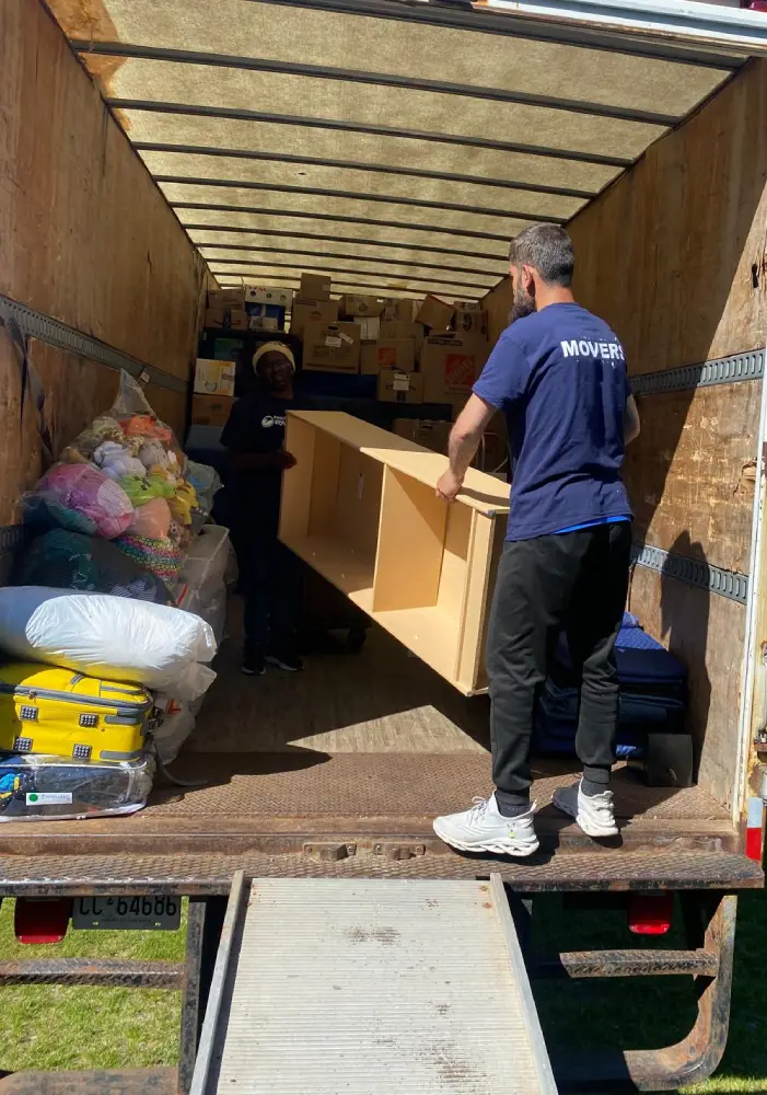 Professional movers preparing belongings for a moving quote