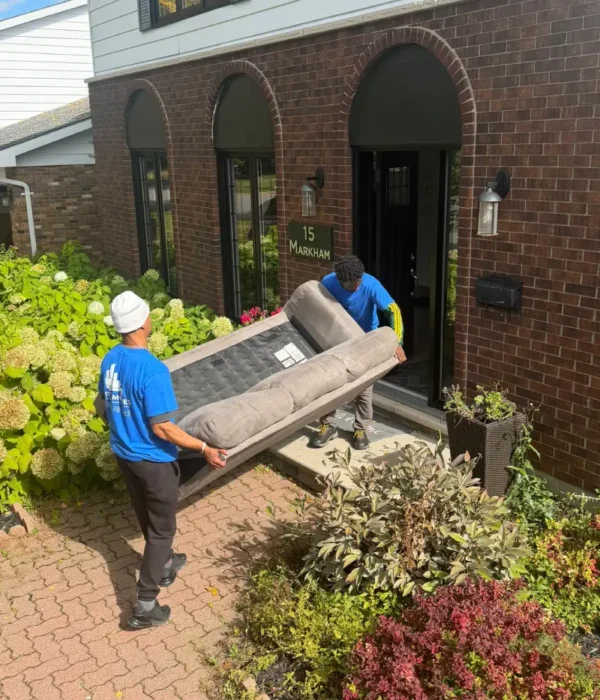 Professional City Moves movers loading furniture into a moving truck