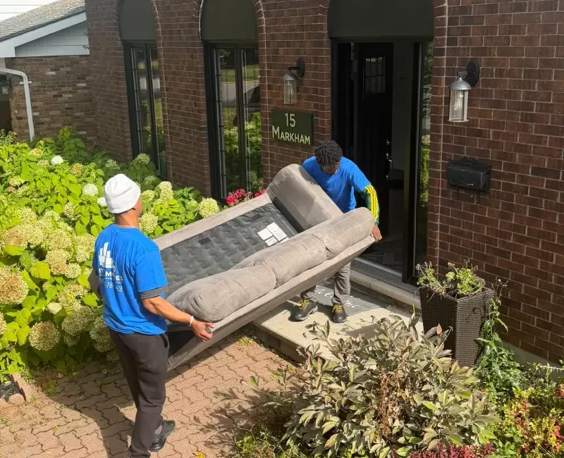 Professional City Moves movers loading furniture into a moving truck