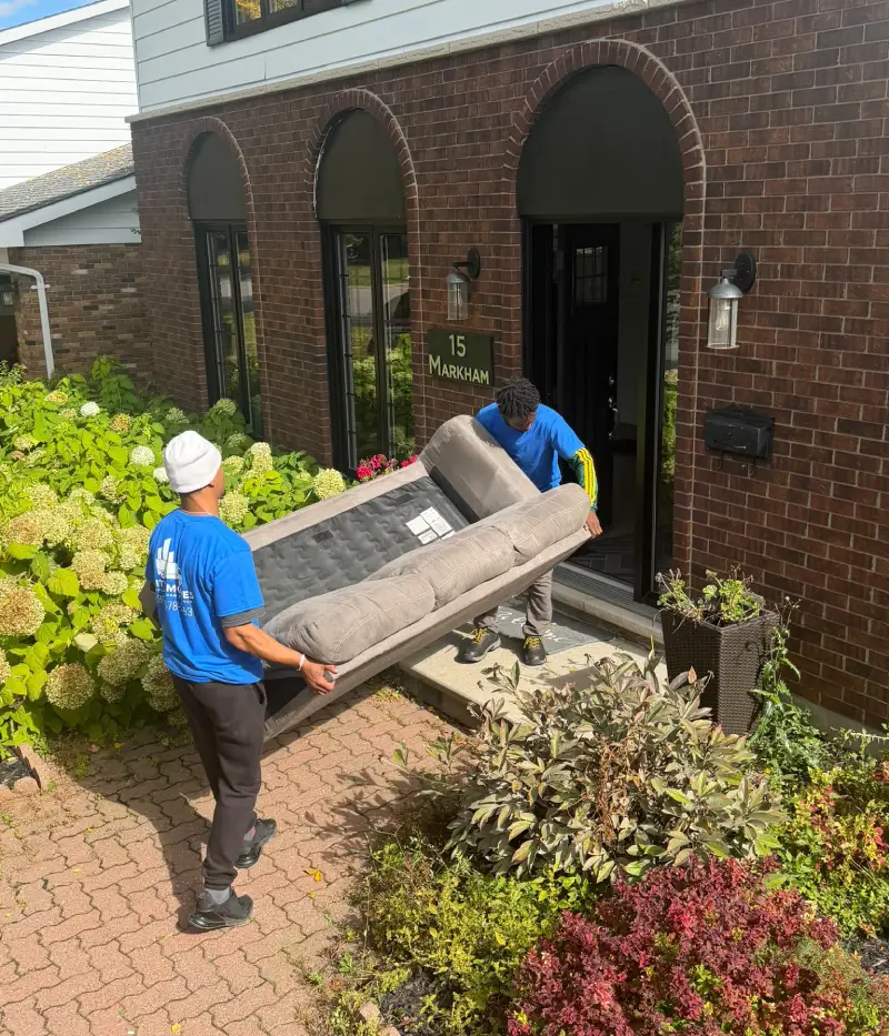 Professional City Moves movers loading furniture into a moving truck